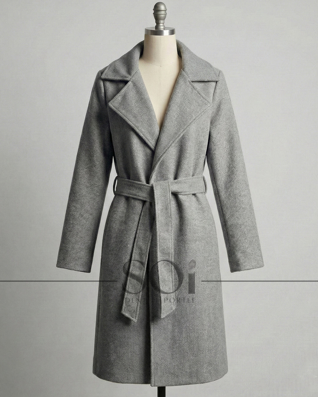 A mid-length tailored coat with a self-tie belt
